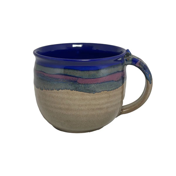Handcrafted ceramic latte mug with a deep cobalt blue interior and earthy textured exterior, perfect for enjoying your favorite tea or coffee.