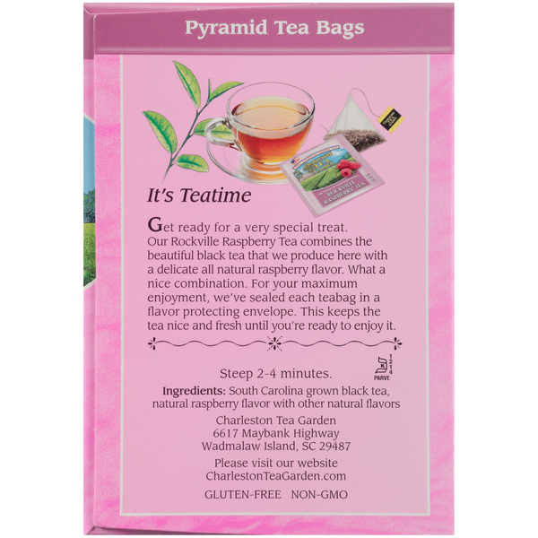 Pink box of pyramid tea bags featuring South Carolina grown black tea with natural raspberry flavor, highlighting freshness and flavor protection for a special tea experience.