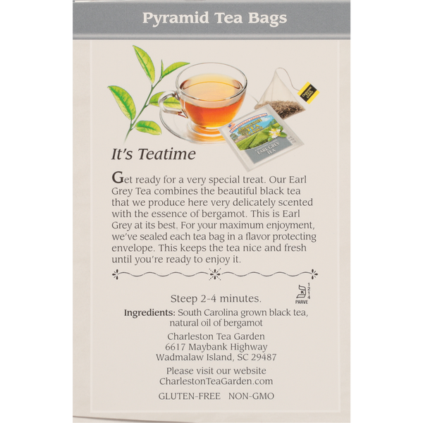 A clear glass cup filled with brewed tea beside a pyramid-shaped tea bag and its packaging, accompanied by a description highlighting the delicate bergamot flavor and fresh-sealed tea bags.