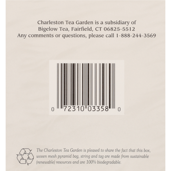 Back of a tea box featuring a barcode, contact information for Charleston Tea Garden, and a note about the eco-friendly, biodegradable pyramid tea bag and packaging materials.