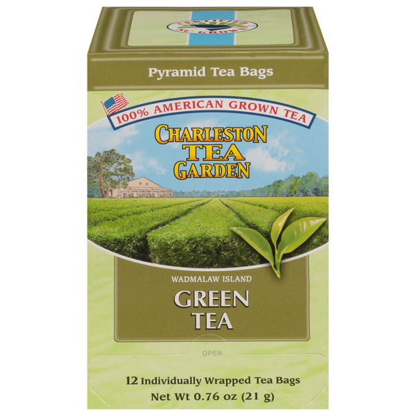 Box of Charleston Tea Garden green tea featuring pyramid tea bags, highlighting American-grown tea from Wadmalaw Island with an image of lush tea fields and fresh leaves.