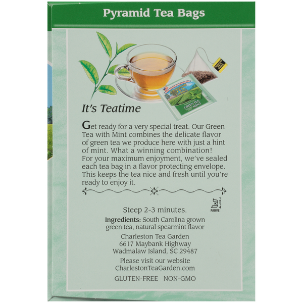 Back of a green tea package showing pyramid tea bags, a cup of brewed tea, and text describing the blend of South Carolina green tea with natural spearmint flavor from Charleston Tea Garden.