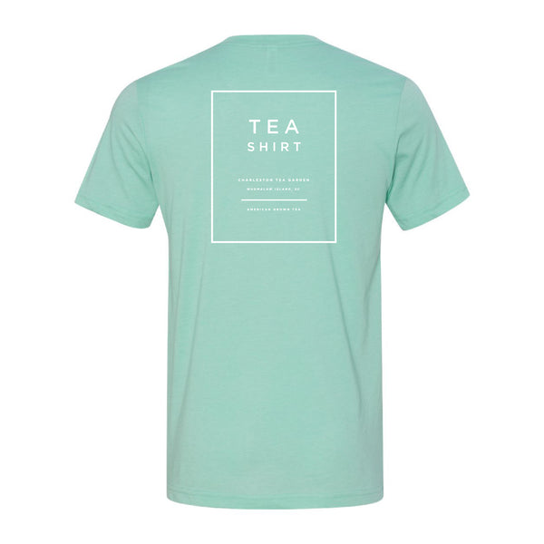 Back view of a soft heather mint t-shirt with simple white text and a square design, perfect casual apparel for tea lovers and Charleston Tea Garden fans.