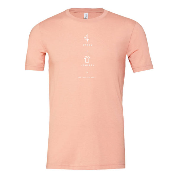 Soft heather peach t-shirt with a simple white graphic related to tea, perfect casual apparel inspired by the Charleston Tea Garden experience.