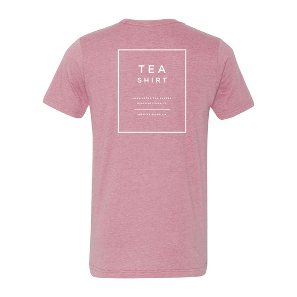 Heather orchid-colored casual T-shirt with simple white text design on the back promoting tea and the Charleston Tea Garden, perfect for tea lovers and souvenirs.