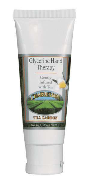 Small white tube of glycerine hand therapy cream infused with tea, featuring a green tea garden image and floral design on the label.