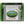 Bar of green tea glycerine soap gently infused with tea from Charleston Tea Garden, wrapped in packaging featuring an image of tea fields and a white flower.