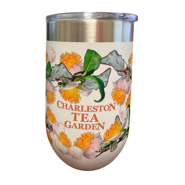 Insulated 16 oz tumbler decorated with colorful tea garden flowers and greenery, featuring the text Charleston Tea Garden, perfect for enjoying tea on the go.