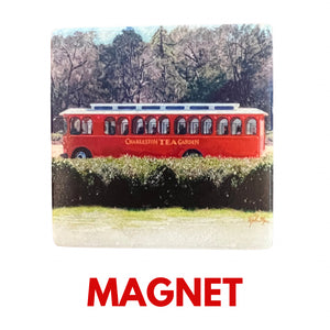 Red trolley with "Charleston Tea Garden" text on the side, surrounded by green tea fields and tall trees in the background, in a detailed painted style.