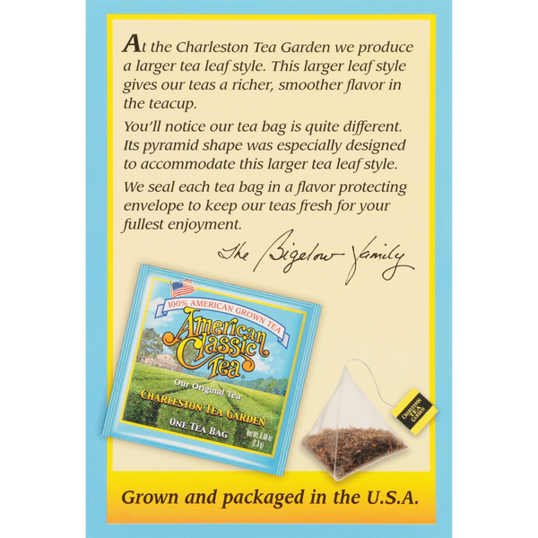 Close-up of an American Classic Tea pyramid-shaped tea bag and its colorful packaging from Charleston Tea Garden, highlighting the larger leaf style and flavor protection.
