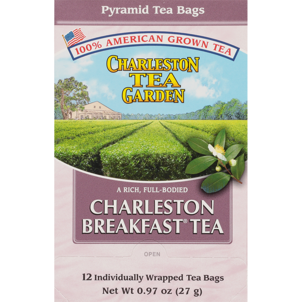 Box of Charleston Breakfast Pyramid tea featuring an illustration of lush green tea fields under a blue sky with a flower detail and American-grown tea branding.