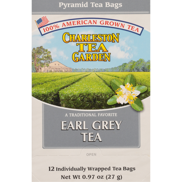 Box of Charleston Tea Garden Earl Grey Pyramid tea featuring an illustration of tea fields and a lemon blossom on a blue sky background.