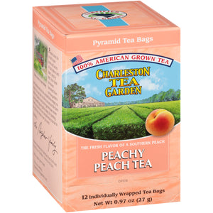Box of peach-flavored pyramid tea bags featuring a scenic view of tea fields and an illustration of a ripe peach, highlighting fresh southern flavor.