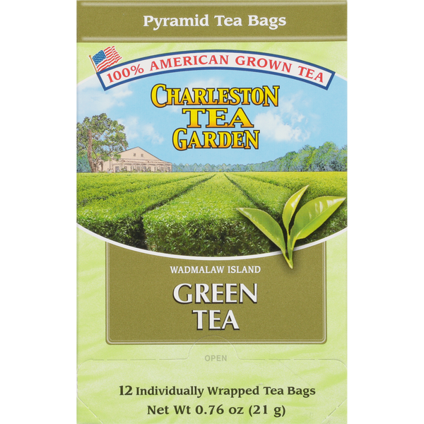 Box of American-grown green tea featuring a scenic image of lush tea fields on Wadmalaw Island, with 12 individually wrapped pyramid tea bags inside.