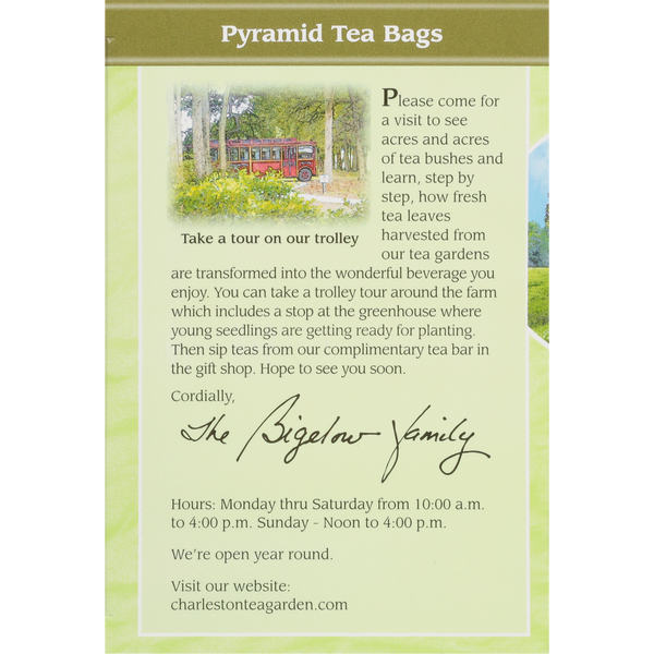 Back panel of Green Tea Pyramid packaging inviting visitors to tour the lush tea fields, ride a trolley, visit the greenhouse, and enjoy complimentary tea at the Charleston Tea Garden.