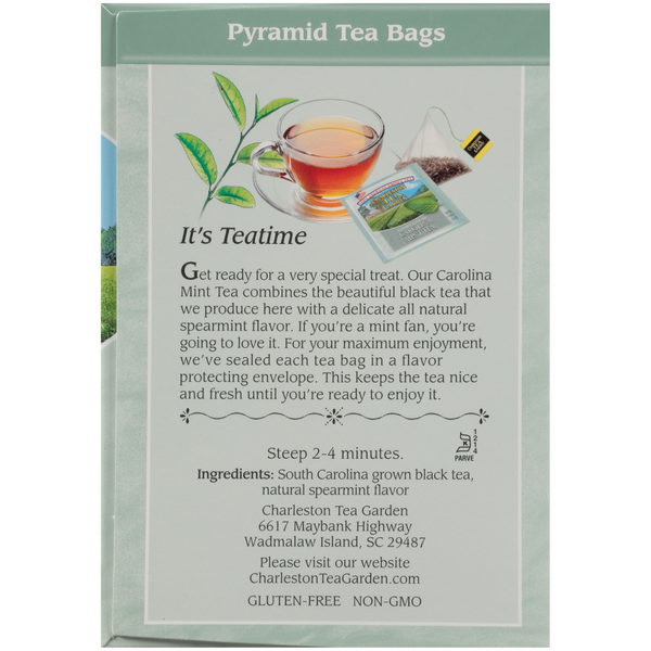 Back of a Carolina Mint Pyramid tea box showing a steaming cup of tea, tea bag images, and text describing the mint-flavored black tea blend with natural spearmint and steeping instructions.