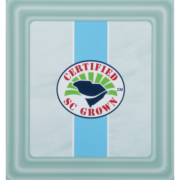 Close-up of a square tea package with a blue stripe and a circular "Certified SC Grown" logo featuring a navy blue and green leaf design.