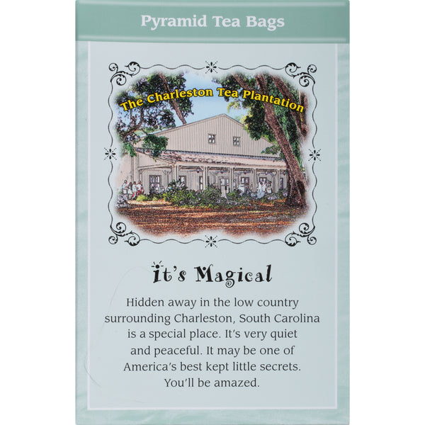 Light green Carolina Mint Pyramid tea bag packaging with an illustration of a traditional tea house surrounded by trees, highlighting the peaceful, hidden charm of Charleston Tea Garden.