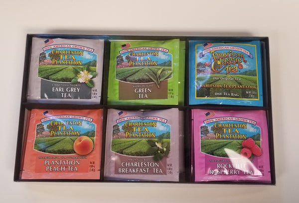 Assorted colorful tea bag packets from Charleston Tea Garden showcasing a variety of flavors, including Earl Grey, Green Tea, Peach, Breakfast, and Rockville Raspberry.