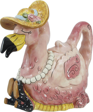 Ceramic flamingo-shaped teapot wearing a yellow sunhat adorned with flowers, pearl necklace, and black polka-dot high heels, showcasing whimsical vintage charm.