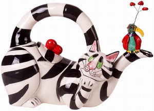 Whimsical black and white striped cat-shaped teapot with bright red heart details and a colorful bird perched on the spout, perfect for charming tea moments.