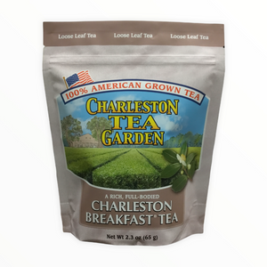 Package of Charleston Breakfast loose leaf tea featuring an illustration of lush green tea fields and a small American flag.
