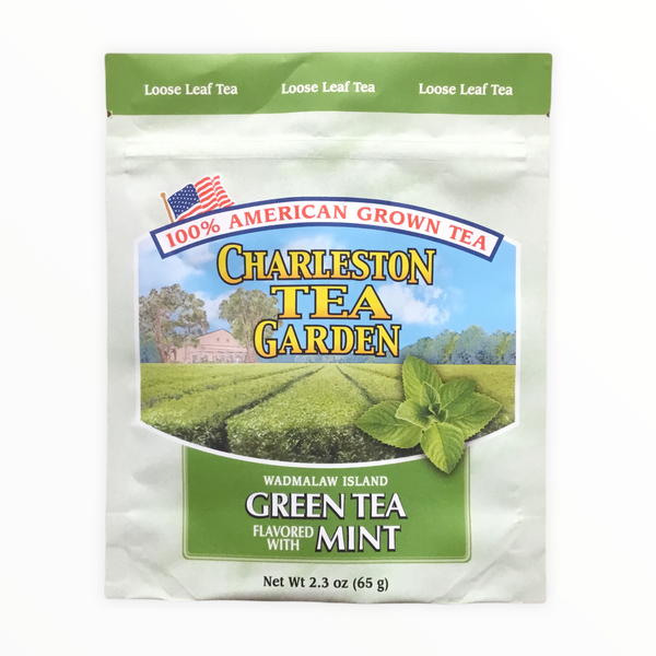 Package of Charleston Tea Garden loose leaf green tea flavored with mint, featuring American-grown tea and imagery of a tea field with fresh mint leaves.